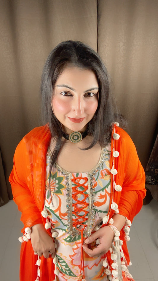 Creamish White and Orange Chiffon Pom Pom Sharara Suit Set with Potli Bag