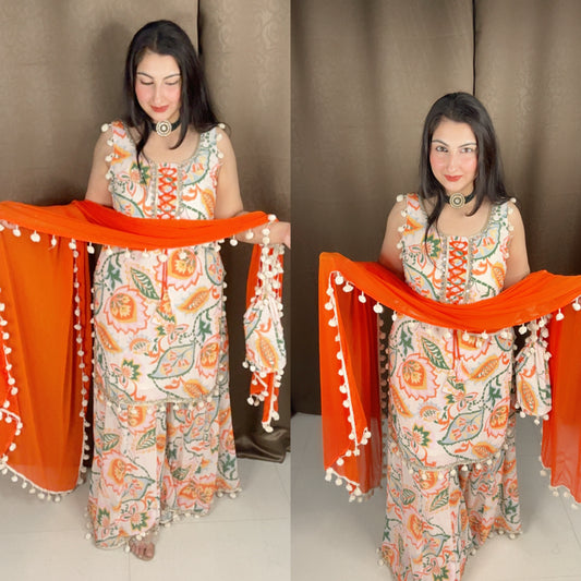 Creamish White and Orange Chiffon Pom Pom Sharara Suit Set with Potli Bag